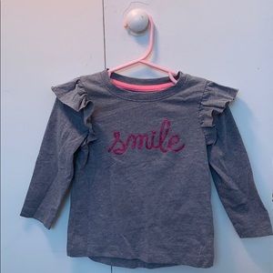 Toddler girl’s smile shirt